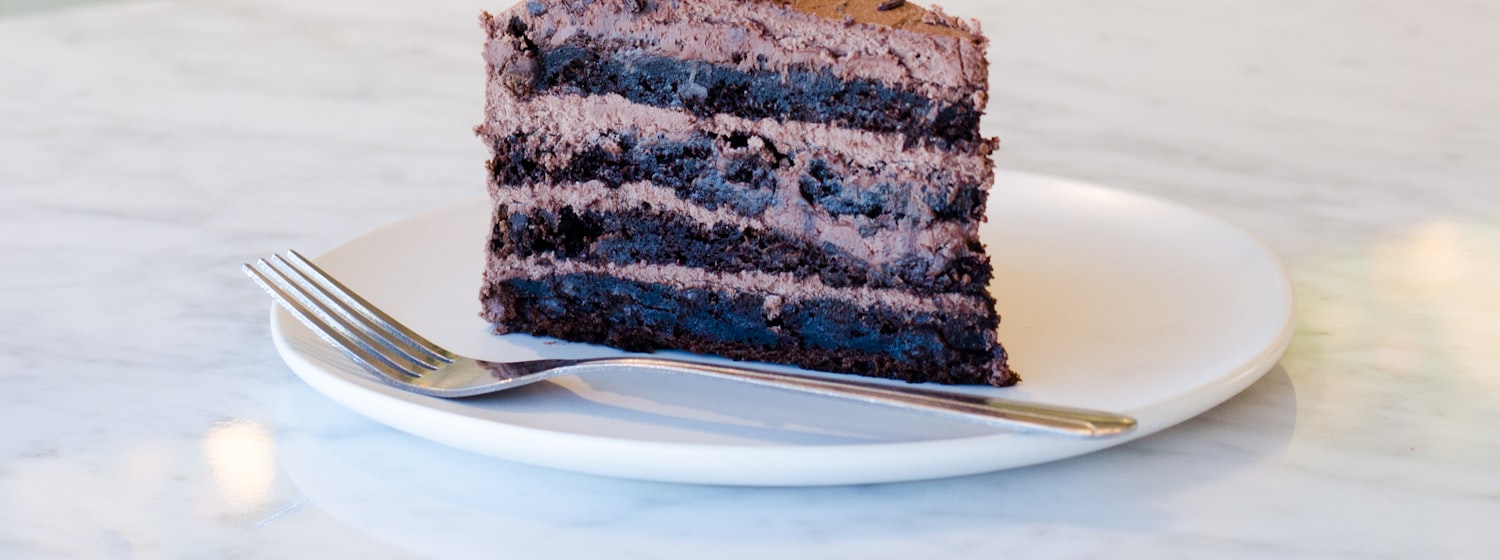 A slice of rich flourless dark chocolate cake