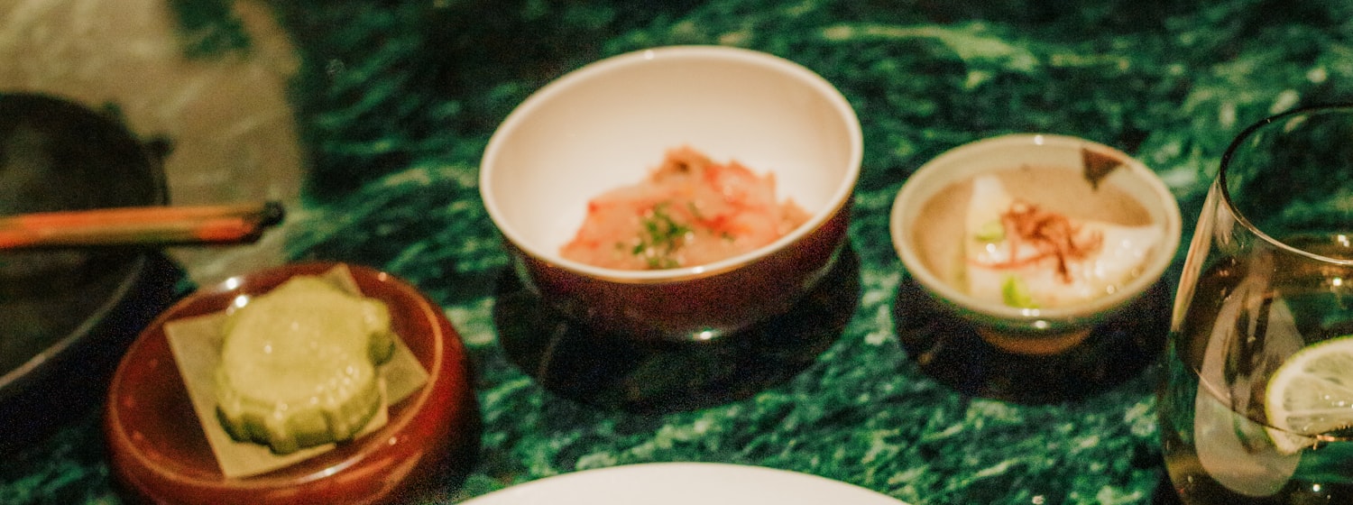 A plated duck dish with sauce and sides