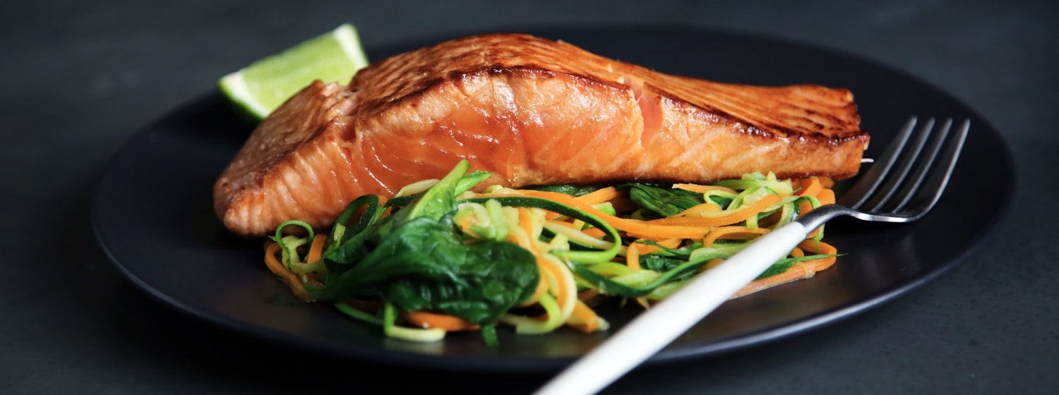 Grilled salmon with vegetables on a plate