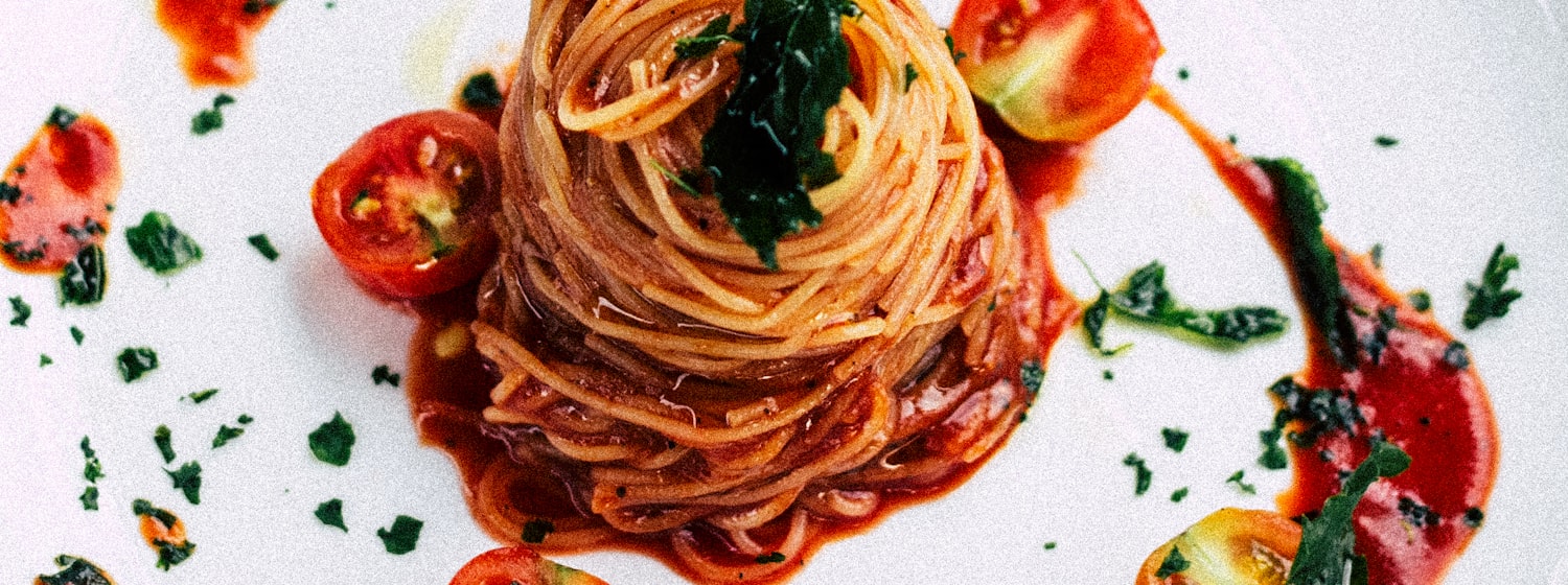 A bowl of spaghetti in tomato sauce